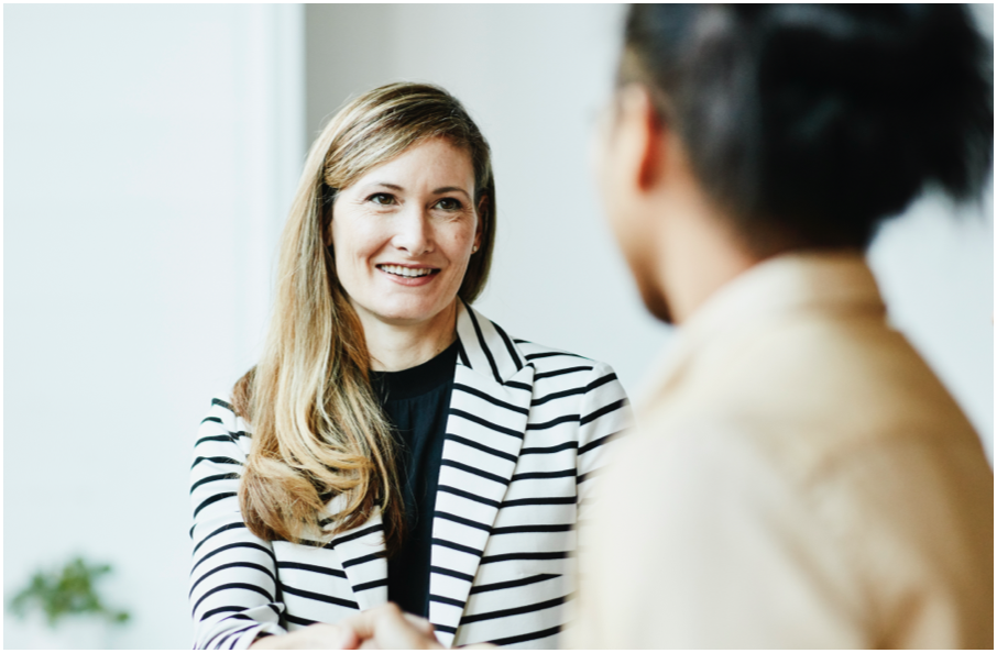 Image of two people talking