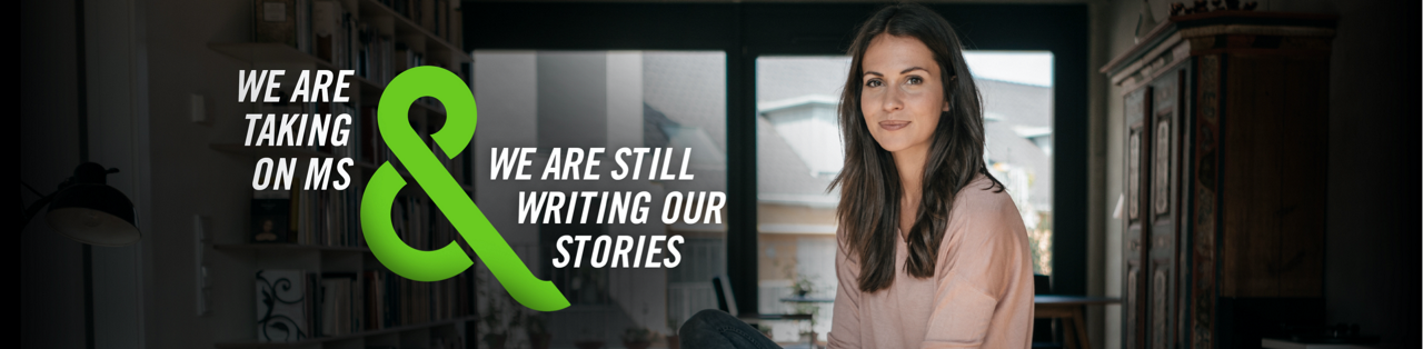 Image of woman in pink sweater with text that says - WE ARE TAKING ON MS & WE ARE STILL WRITING OUR STORIES