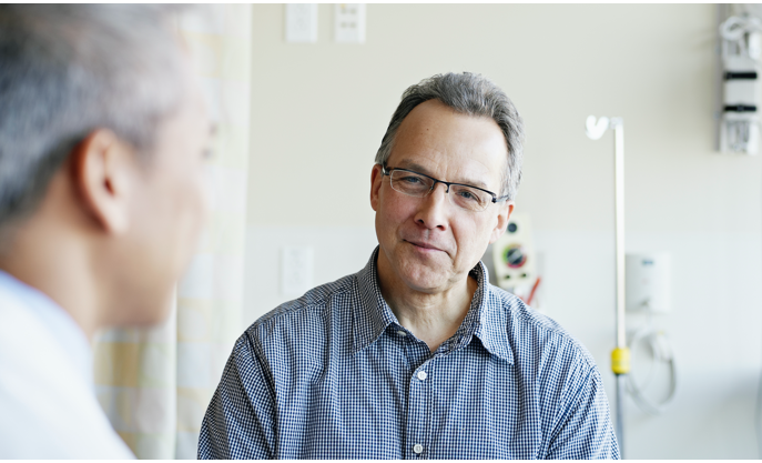 Image of a healthcare professional talking to a patient with RMS