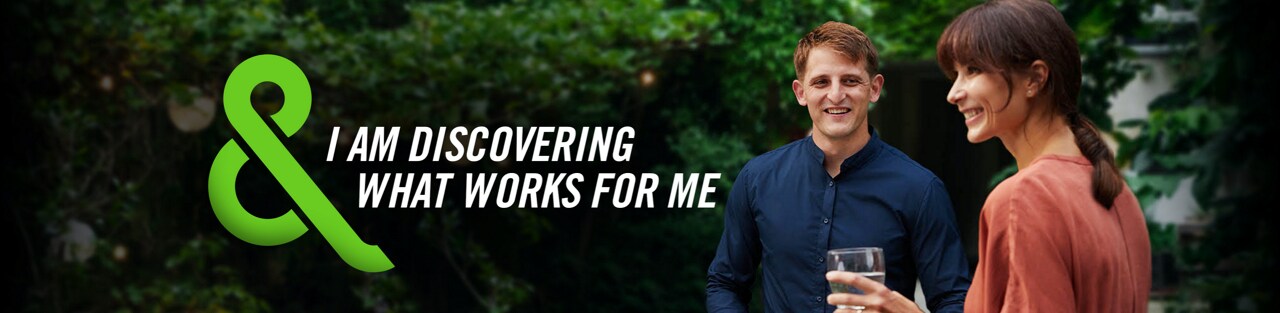 Image of two men talking with text that says – I AM DISCOVERING WHAT WORKS FOR ME
